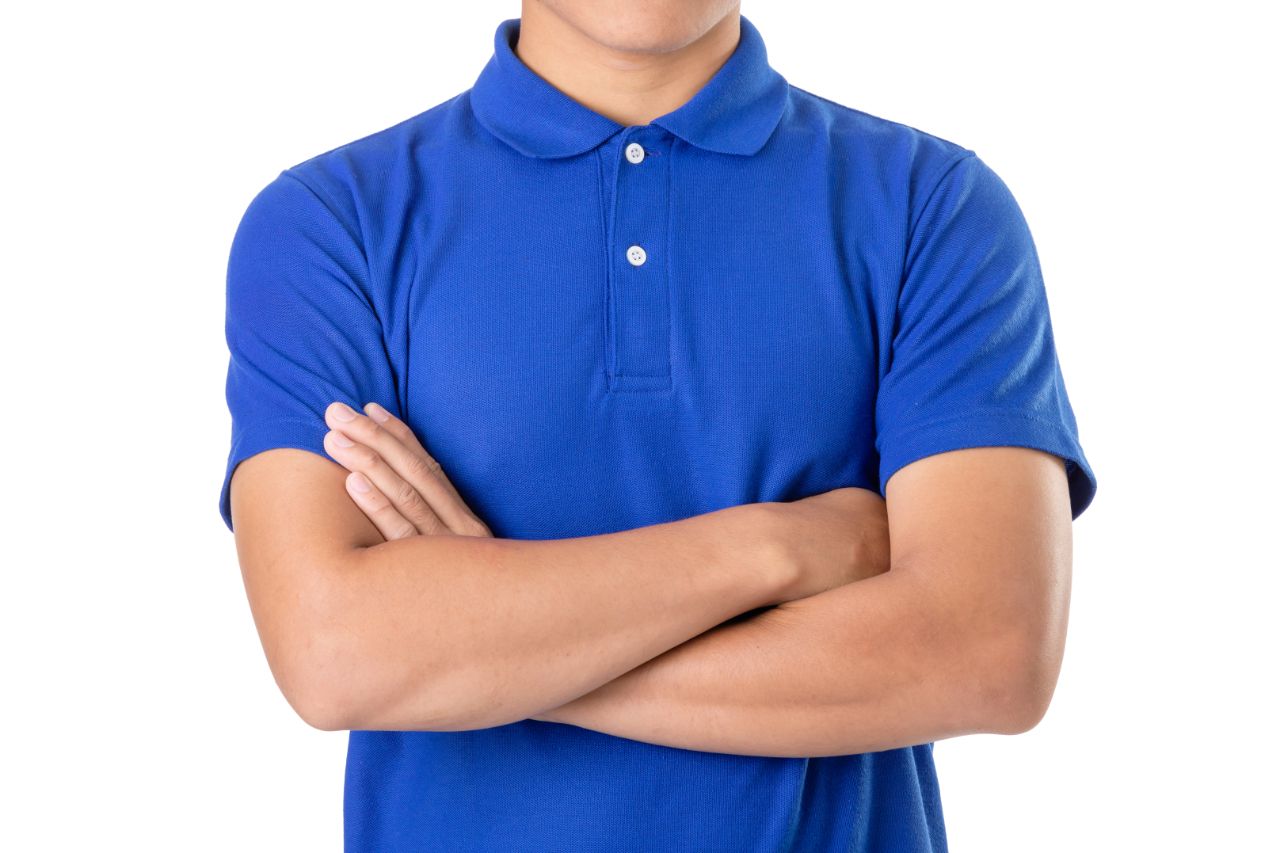 A man wearing a blue polo shirt